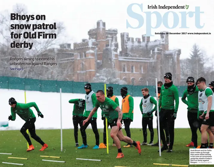  ?? IAN MacNICOL/GETTY ?? Scott Brown and his Celtic team-mates go through their paces while training in the snow at Lennoxtown yesterday ahead of today’s Old Firm derby against Rangers