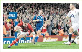  ??  ?? Made in Wales: Alex Cuthbert goes over for his second try in Cardiff