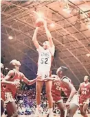  ?? FROM TOM WILSON SOCIAL MEDIA ?? Manual High School forward Tom Wilson (52) shoots over the Peoria High School defense in a game between the rivals in the late 1980s.