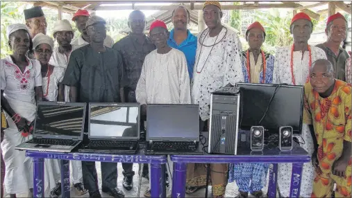  ?? PHOTO SUBMITTED BY CAPE BRETON UNIVESRITY ?? Dr. Princely Ifinedo delivered computers to community members associated with Obodeti Secondary Commercial School in Delta State in Nigeria. Pictured, starting sixth from left: Mr. Chinedu (wearing glasses), R. Ajameh, Mr. Taiye Ozah, Chief Joseph...