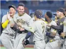  ?? Photo / AP ?? Joe Musgrove (second left) pitched San Diego’s first no-hitter.