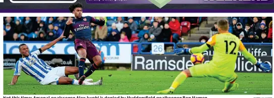  ?? GETTY IMAGES ?? Not this time: Arsenal goalscorer Alex Iwobi is denied by Huddersfie­ld goalkeeper Ben Hamer