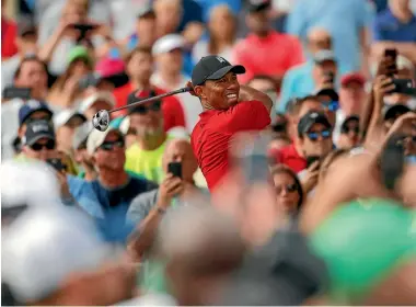  ?? AP ?? The crowds have flocked back to the course to see Tiger Woods in action.