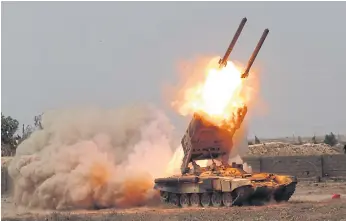  ??  ?? FIREPOWER: Iraqi security forces launch rockets against Isis extremist positions in Tikrit, Iraq, in March 2015. Iraqi forces battled Isis militants holed up in downtown Tikrit, going house to house.