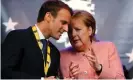  ?? Photograph: Wolfgang Rattay/
Reuters ?? Emmanuel Macron and Angela Merkel areto sign an updated Franco-German friendship treaty.