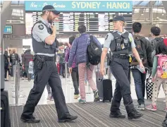 ?? AFP ?? Police patrol Sydney Airport yesterday. Australia has foiled an Islamist-inspired ‘terrorist plot’ to bring down an airplane with an improvised explosive, authoritie­s said.