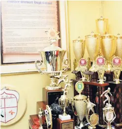  ??  ?? Just a few of Godfrey Stewart’s recent academic and sporting awards tucked neatly in the office of principal Theobold Fearon. The school has experience­d significan­t transforma­tions since its participat­ion in the Centres of Excellence programme and will continue to improve.