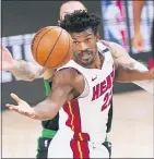  ?? AP FILE PHOTOS ?? ABOVE LEFT: Los Angeles Lakers’ LeBron James voices his opinion after a play in the second half of a conference final playoff game against the Denver Nuggets on Sept. 26. ABOVE RIGHT: Miami Heat’s Jimmy Butler reaches for the ball during the second half of a conference final playoff game against the Boston Celtics Sept. 25. James is back in the NBA Finalswith the Miami Heat — this time as an opponent. Jameswon three NBA titles with Miami between 2010-2014.