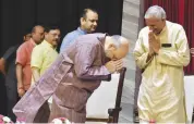  ?? PTI ?? BJP President Amit Shah greets RSS ideologue Bajrang Lal Gupta at a function in New Delhi on Sunday.