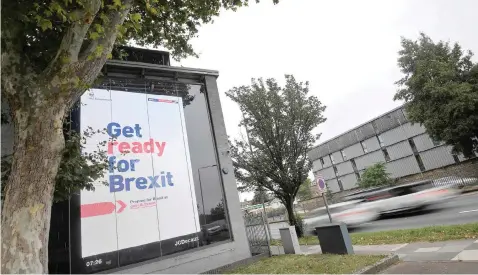  ??  ?? AN ELECTRONIC billboard displays a British government Brexit informatio­n awareness campaign advertisem­ent in west London. |