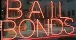  ?? FILE ?? A sign advertisin­g a bail bonds business is displayed near Brooklyn’s jail and courthouse complex in New York in 2015. Lawmakers in New York eliminated cash bail for most misdemeano­r and nonviolent felony offenses in 2020.