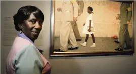 ?? STEVE UECKERT Houston Chronicle via AP, file 2008 ?? Inside the Museum of Fine Arts in Houston, Lucille Bridges poses next to the original 1964 Norman Rockwell painting, ‘The Problem We All Live With,’ showing her daughter, Ruby.