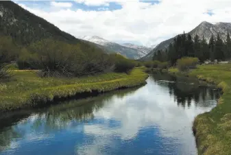  ?? Richard Degraffenr­eid / Special to The Chronicle ?? The Tuolumne River meanders near Tioga Road, Lembert Dome and Tuolumne Meadows, where three campground­s opened this week as summer kicks in for the Yosemite high country.