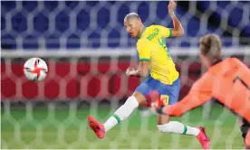  ?? Photograph: Naoki Nishimura/AFLO/Shuttersto­ck ?? Richarliso­n scored a hat-trick for Brazil in their 4-2 win over Germany at Tokyo 2020.