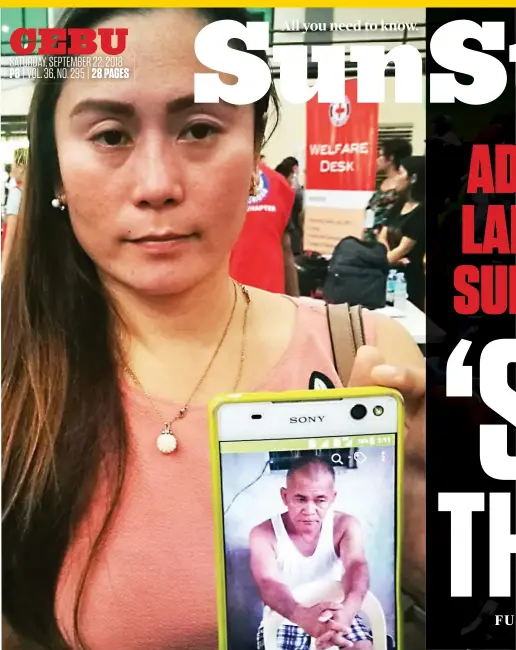  ?? SUNSTAR FOTO/ALLAN CUIZON ?? HOPE DASHED. Lucille Campanilla-Villamor shows SunStar a photo of her missing uncle, Lauro Campanilla. Hours later, she found his name in the list of dead residents pulled out of the rubble. (More on pages 2, 4, 6, 8 and 9).