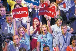  ?? JIM WILSON/THE NEW YORK TIMES ?? Delegates react as Hillary Clinton makes a video appearance at the end of the second day of the Democratic National Convention at the Wells Fargo Center in Philadelph­ia. Democrats formally nominated Clinton for president on Tuesday, making her the...