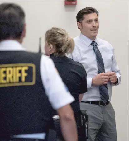  ?? MAX HERMAN/FOR THE SUN-TIMES ?? Chicago Police Officer Robert Rialmo, the officer who shot and killed Quintonio LeGrier and Bettie Jones in December 2015, leaves court at the Daley Center last month.