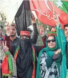  ?? ABDUL MAJEED/AFP VIA GETTY IMAGES ?? Supporters of Imran Khan’s Pakistan Tehreek-e-Insaf party block a highway on Monday in Peshawar as they protest what they say was the skewing of Pakistan’s election results.