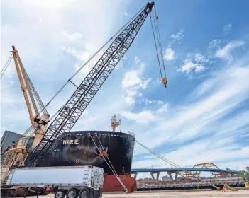  ?? PHOTOS BY JOVANNY HERNANDEZ / MILWAUKEE JOURNAL SENTINEL ?? The Polsteam cargo ship Narie docks at the Port of Milwaukee on June 10 delivering massive coils to be used in constructi­on for buildings downtown.