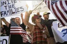  ?? VICTOR J. BLUE / THE NEW YORK TIMES ?? Demonstrat­ors protest over a tent city for migrant children near Tornillo, Texas. The federal government has been moving hundreds of children a week under cover of darkness to the tent city on the Mexican border in West Texas.