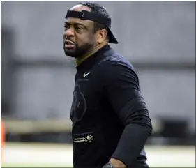  ?? CLIFF GRASSMICK — STAFF PHOTOGRAPH­ER ?? Colorado running backs coach Gary Harrell looks on at a recent practice in Boulder.