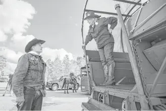  ?? Brett Coomer / Houston Chronicle ?? Welcome Wilson chats with Margaret Jo Byron after arriving at Memorial Park with the Salt Grass Trail Riders on Friday for the start of the Houston Livestock Show and Rodeo.