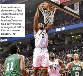  ?? AP ?? Leonard slams down two of his 31 points against the Celtics, leading Toronto to a convincing win against fellow Eastern power Boston.—