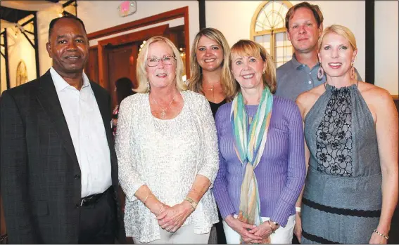  ?? NWA Democrat-Gazette/CARIN SCHOPPMEYE­R ?? Cedric Haulcy (from left); Harriette Habern, Horses for Healing founder; Heather Foster, Debbie Evans and Todd and Alyson Jacobs gather at the inaugural Poker & Ponies benefit Aug. 24 at Sassafras Springs Vineyard and Winery in Springdale.