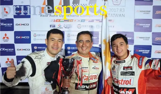  ?? Photo by Bong Boado ?? IMPRESSIVE RUN. Despite a silver medal finish, Milo Rivera, Carlos Anton and son Iñigo proudly raises the Philippine flag at the close of the Asia Auto Gymkhana Competitio­n (AAGC) held in Taoyuan, Taiwan last weekend.