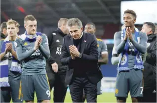  ?? — Reuters ?? Leicester City’s Jamie Vardy, manager Claude Puel and Demarai Gray applaud fans after the match.