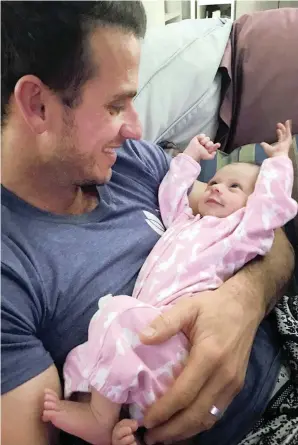  ?? PICTURE: ASHLEY RITCHIE ?? VITAL: Nicholas Ritchie with his baby Lavender Grace Ritchie. The first 1000 days of a child’s life are crucial. It is important, however, that factors acting as barriers to this be addressed, say the writers.