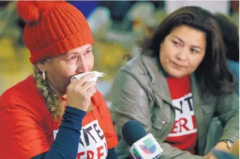  ?? DAMIAN DOVARGANES/ASSOCIATED PRESS ?? Diana Paredes, left, and Isabel Barrera react to the announceme­nt Monday that as many as 200,000 Salvadoran refugees in the United States will have to return home by September 2019.