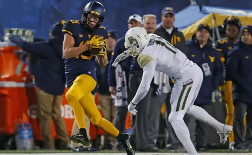  ?? Justin K. Aller/Getty Images ?? Saturday’s game features two of the nation’s best receivers, West Virginia’s David Sills V, above, and Oklahoma State’s Tylan Wallace.