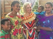  ?? Photo: Nacanieli Tuilevuka ?? Jazmin Grace Grimaldi (garlanded)with locals on September 19, 2018.