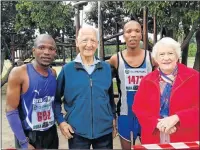  ?? Picture: SUPPLIED ?? WINNERS ALL: Luthando Hejana, left, and Bulelani Mgubo, first and second in the race with Trevor Gee and his wife Nora