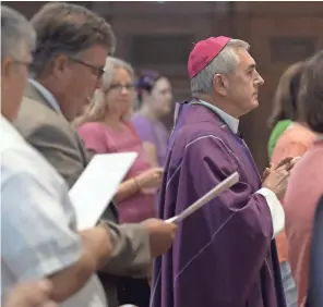  ??  ?? Bishop Ronald Gainer arrives at St. Patrick Cathedral in Harrisburg, Pa., on Friday to celebrate a Mass of Forgivenes­s in response to a grand jury report on sexual abuse by Catholic clergy.