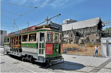  ??  ?? The Christchur­ch tram passes the earthquake-damaged Christ Church Cathedral. What worked in Christchur­ch was the combinatio­n of top down and bottom up approaches being joined up.