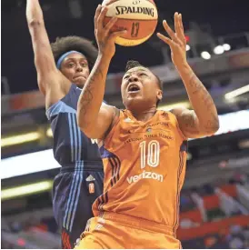  ?? MICHAEL CHOW/AZCENTRAL SPORTS ?? Phoenix Mercury forward Emma Cannon (10) lays the ball up against Atlanta Dream guard Brittney Sykes (7) at Talking Stick Resort Arena in Phoenix.