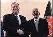  ?? POOL PHOTO VIA AP ?? Secretary of State Mike Pompeo, left, shakes hands with Afghan President Ashraf Ghani at the Munich Security Conference in Munich, Germany, on Friday.