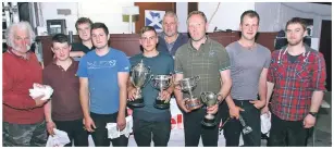  ?? a26shearin­gcomp02no ?? The main trophy winners and judges at the North Argyll Young Farmers’ Club sheep shearing competitio­n held in Oban Livestock Centre.