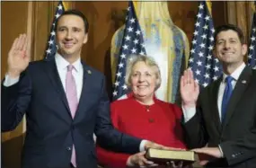  ?? ZACH GIBSON – ASSOCIATED PRESS FILE PHOTO ?? In this Jan. 3, 2017 file photo, House Speaker Paul Ryan of Wis. administer­s the House oath of office to U.S. Rep. Ryan Costello, R-6, during a mock swearing in ceremony on Capitol Hill in Washington. Both Costello and Ryan announced earlier this year they would not seek re-election.