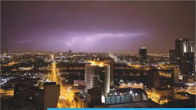  ??  ?? KUWAIT: Lightning fills the sky spectacula­rly as a storm passes through Kuwait on Thursday. —KUNA