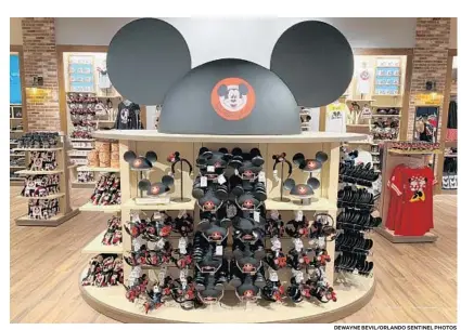  ?? DEWAYNE BEVIL/ORLANDO SENTINEL PHOTOS ?? The new Mickey Mouse Club collection has traditiona­l headgear with a twist and a related (and shiny) headband.