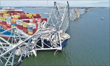  ?? REUTERS ?? A drone view of the Dali cargo vessel, which crashed into the Francis Scott Key Bridge causing it to collapse, in Baltimore, Maryland, US, on Tuesday.