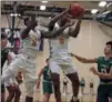  ?? RANDY MEYERS — FOR THE MORNING JOURNAL ?? Brandon Rush of Warrensvil­le pulls down a rebound against Elyria Catholic during the second quarter on March 5.