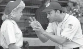  ?? THE ASSOCIATED PRESS ?? A scene from the movie "A League of Their Own" as manager Jimmy Dugan (Tom Hanks) admonishes Evelyn Gardner (Bitty Schram) with the memorable line "there’s no crying in baseball."