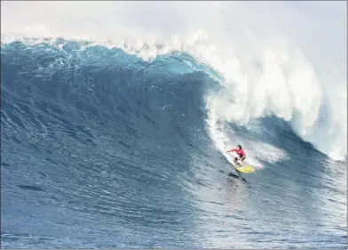  ?? RED BULL ?? GUESS WHO’S COMING TO DINNER: Kai Lenny charges a big wave at Jaws in Hawaii.