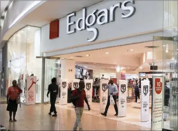  ?? PHOTO: REUTERS ?? Edcon opened 34 new stores in the quarter to the end of December, but its gross profit dropped to R2.907 billion.