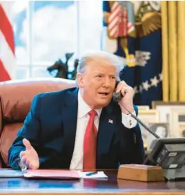  ?? HOUSE SELECT COMMITTEE ?? In a photo released by the House select committee investigat­ing the attack on the U.S. Capitol, President Donald Trump talks on the phone with Vice President Mike Pence from the Oval Office on the morning of Jan. 6, 2021.