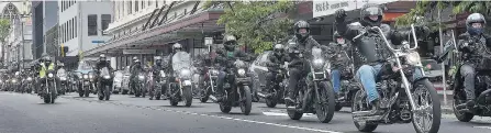  ??  ?? On the move . . . Motorcycli­sts head down Stuart St, towards the Dunedin Railway Station, during a motorcycle run on Saturday to raise awareness of teen suiciderel­ated issues.